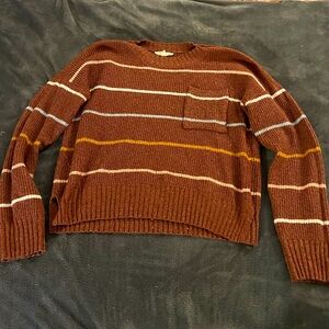 Burgundy sweater with colorful stripes